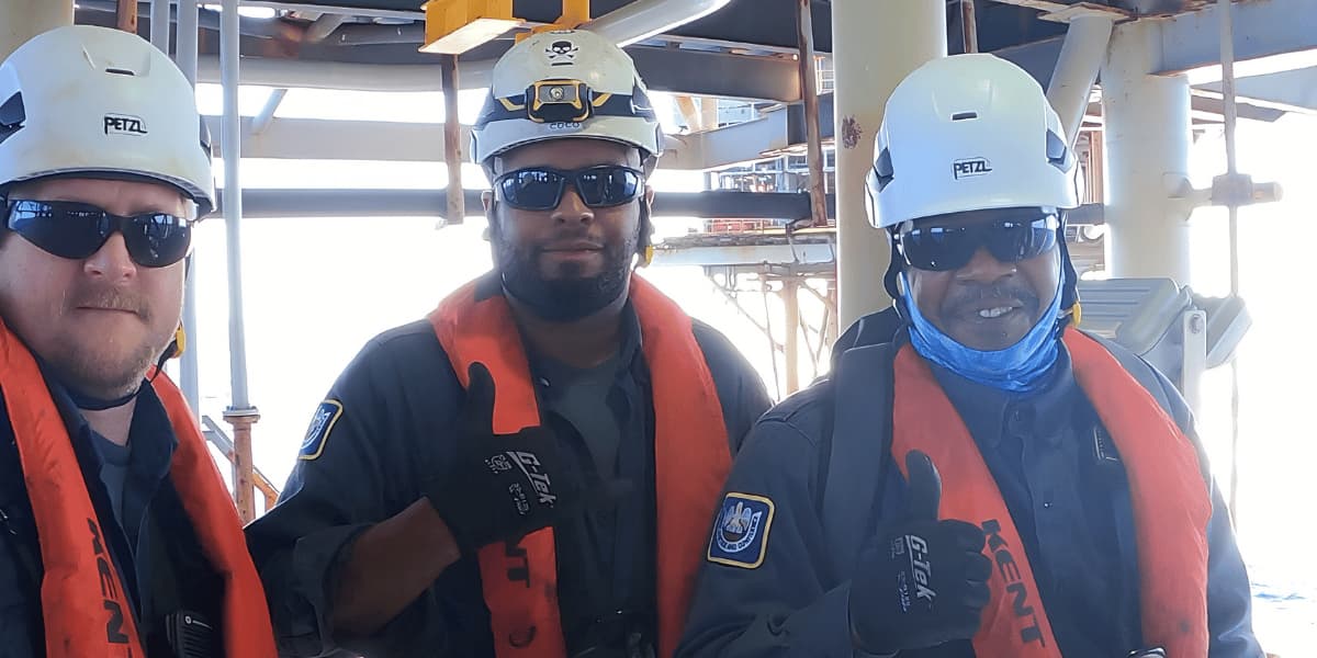 Trussco team members working together in an offshore environment
