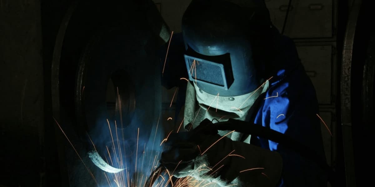 Industrial welder performing structural welding for marine and offshore equipment